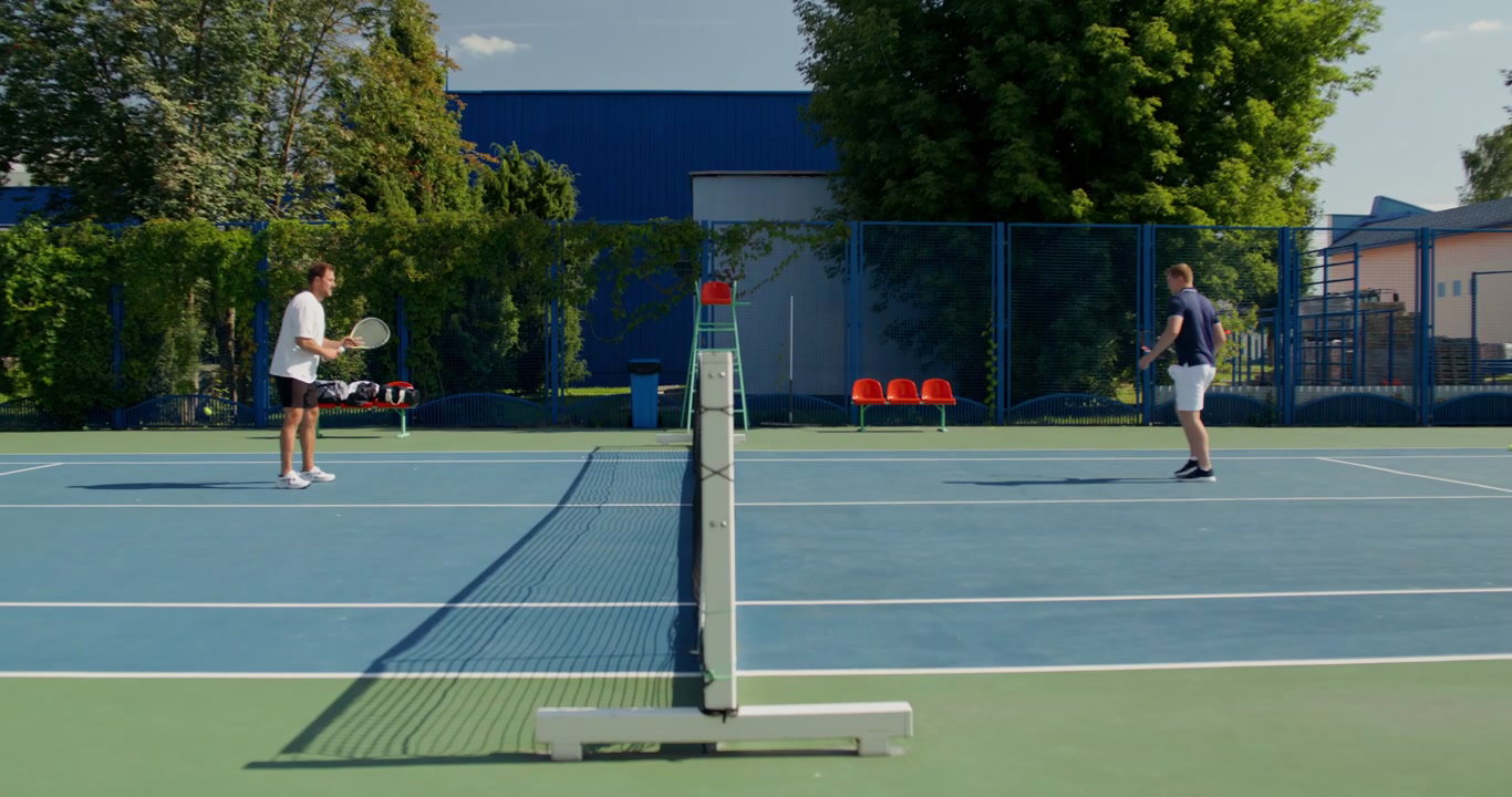 Two Men Playing Tennis