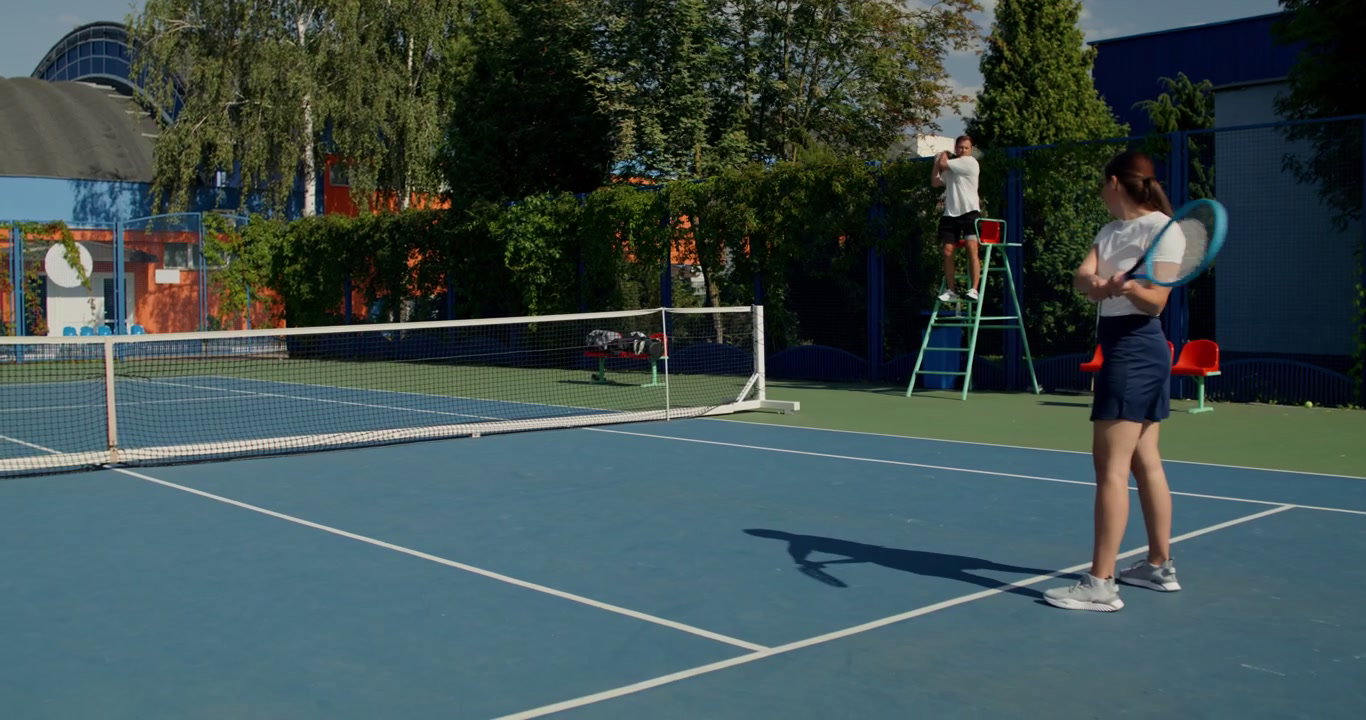 Man Serving in a Tennis Match