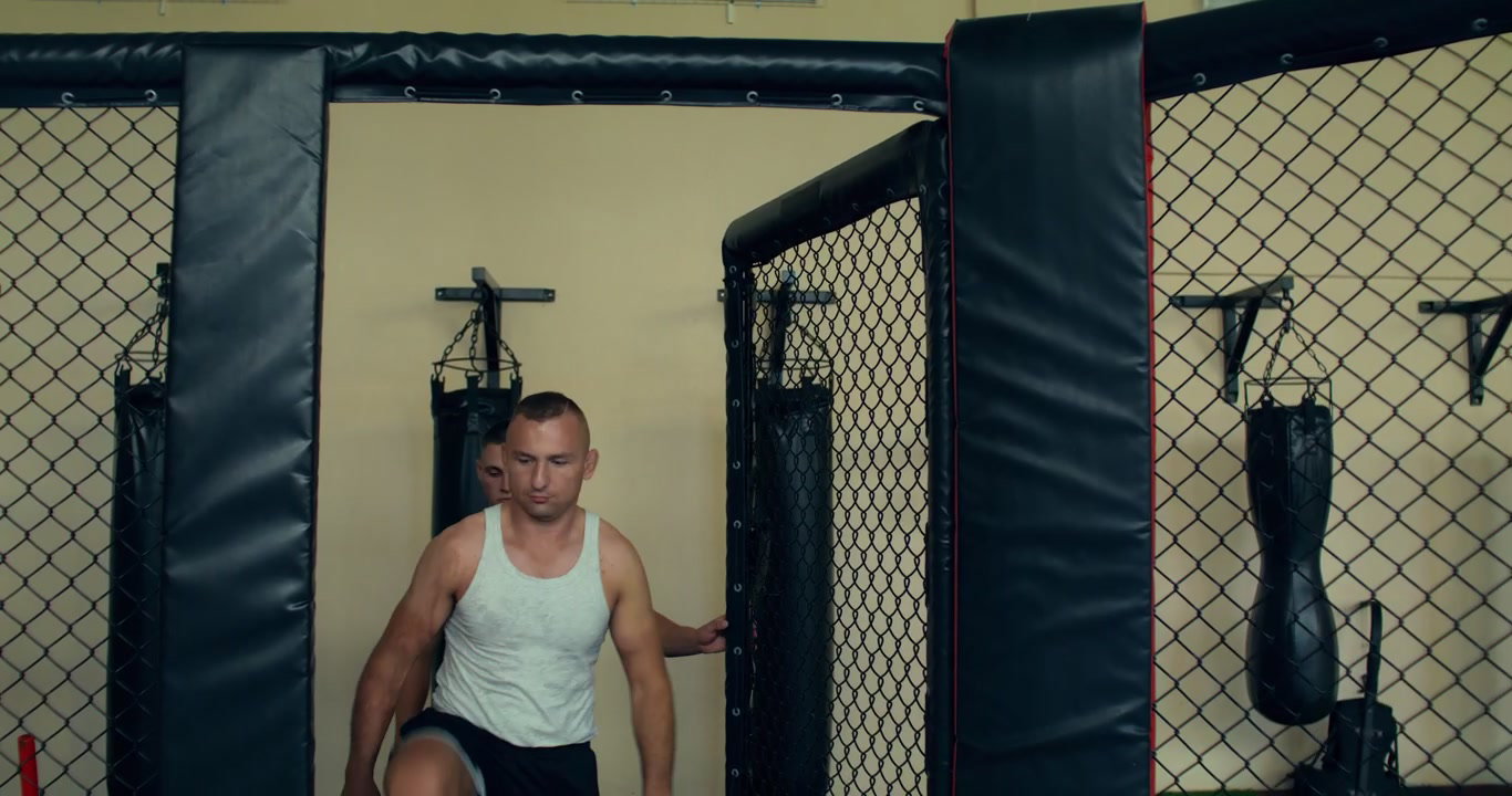 Two Men Entering MMA Cage